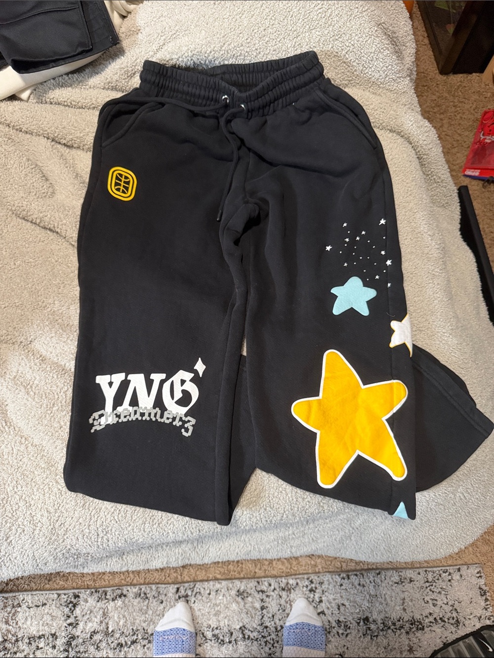 Black Graphic Star Sweatpants with Yellow Accent